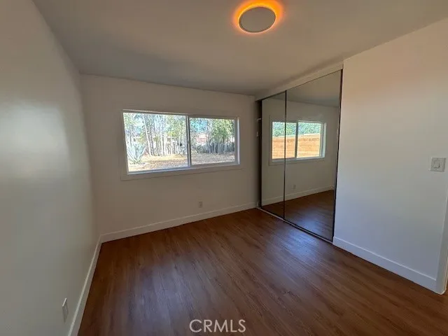14621 Clark Street Baldwin Park, CA 91706 - Photo 14 of 28 an empty room with wooden floor and windows