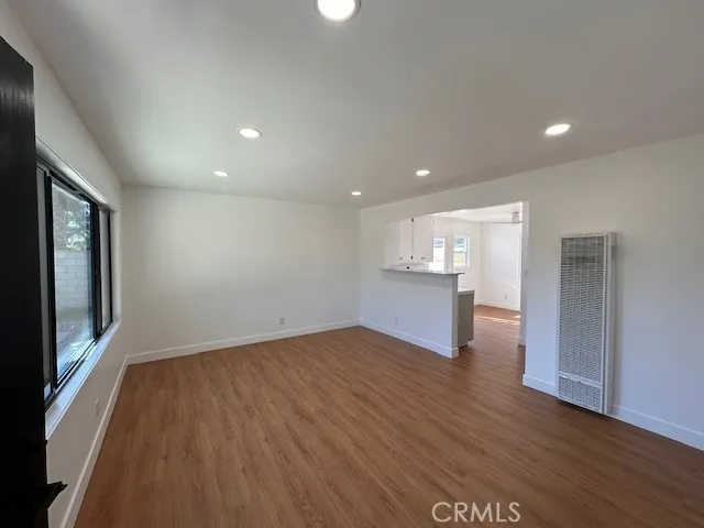 14621 Clark Street Baldwin Park, CA 91706 - Photo 4 of 28 a view of empty room with wooden floor and fan