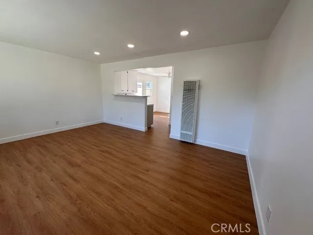 14621 Clark Street Baldwin Park, CA 91706 - Photo 6 of 28 an empty room with wooden floor and windows