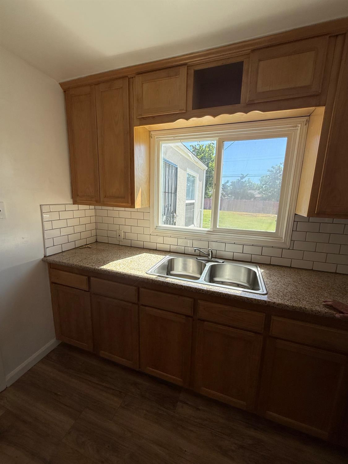 501 Rotan Avenue Madera, CA 93637 - Photo 3 of 23 a kitchen with a sink and cabinets