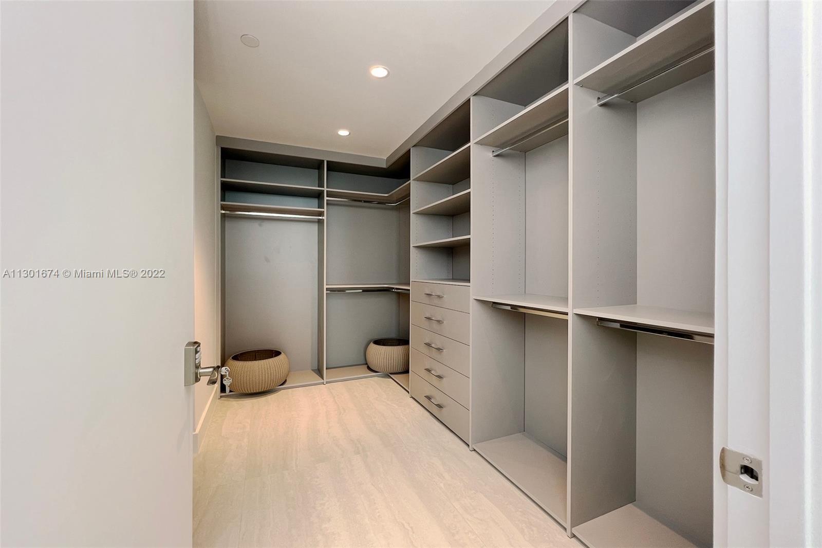 North Beach Miami Beach, FL 33141 - Photo 12 of 23 a view of walk in closet with empty racks