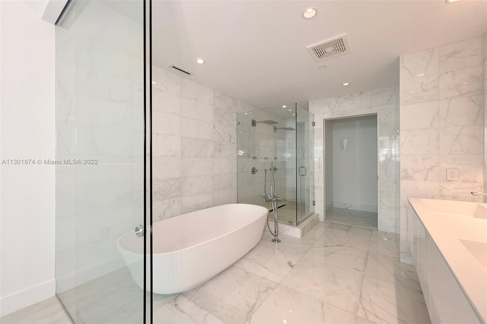 North Beach Miami Beach, FL 33141 - Photo 14 of 23 a bathroom with a bathtub and a shower