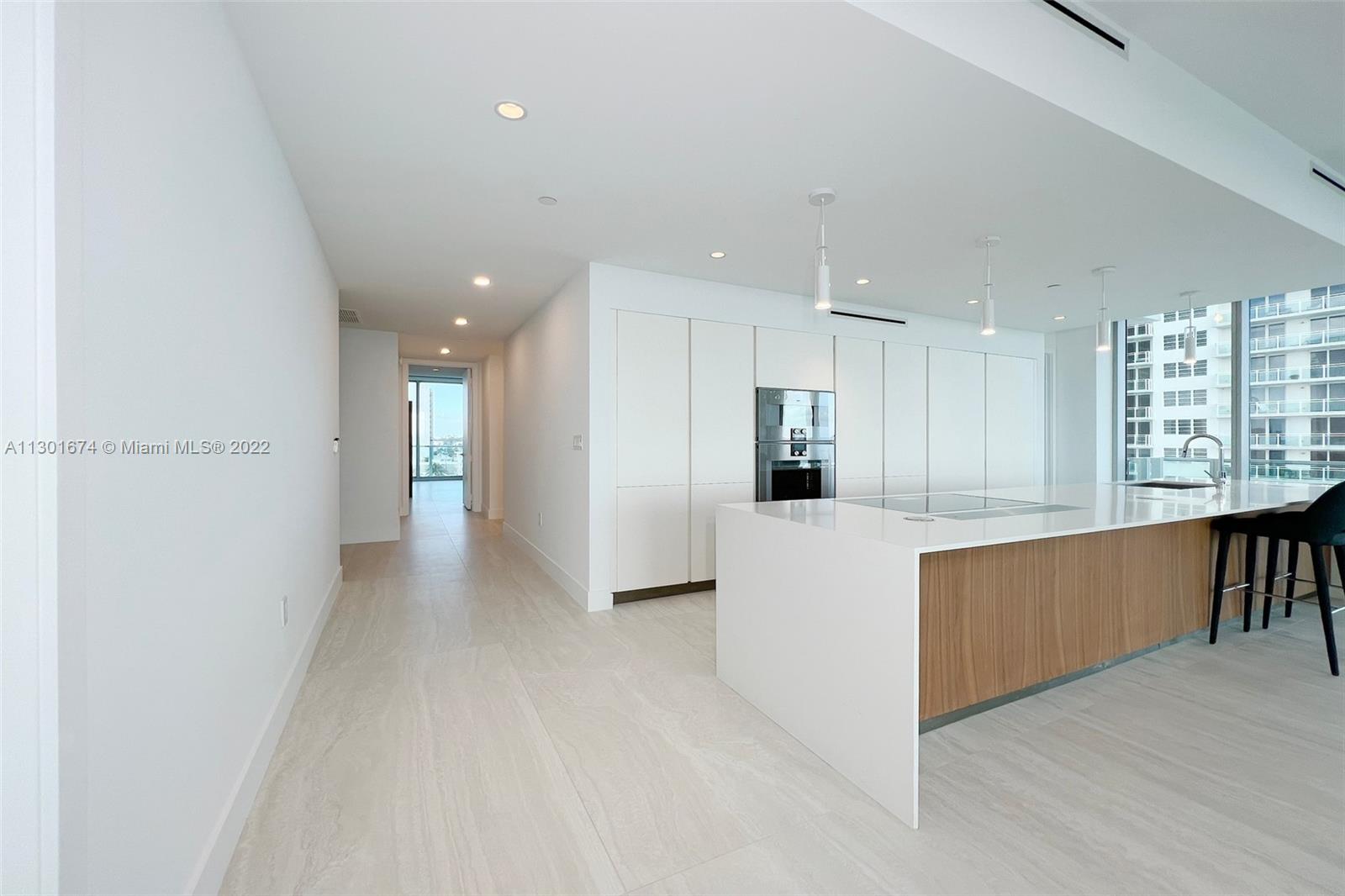 North Beach Miami Beach, FL 33141 - Photo 18 of 23 a view of kitchen with refrigerator and window