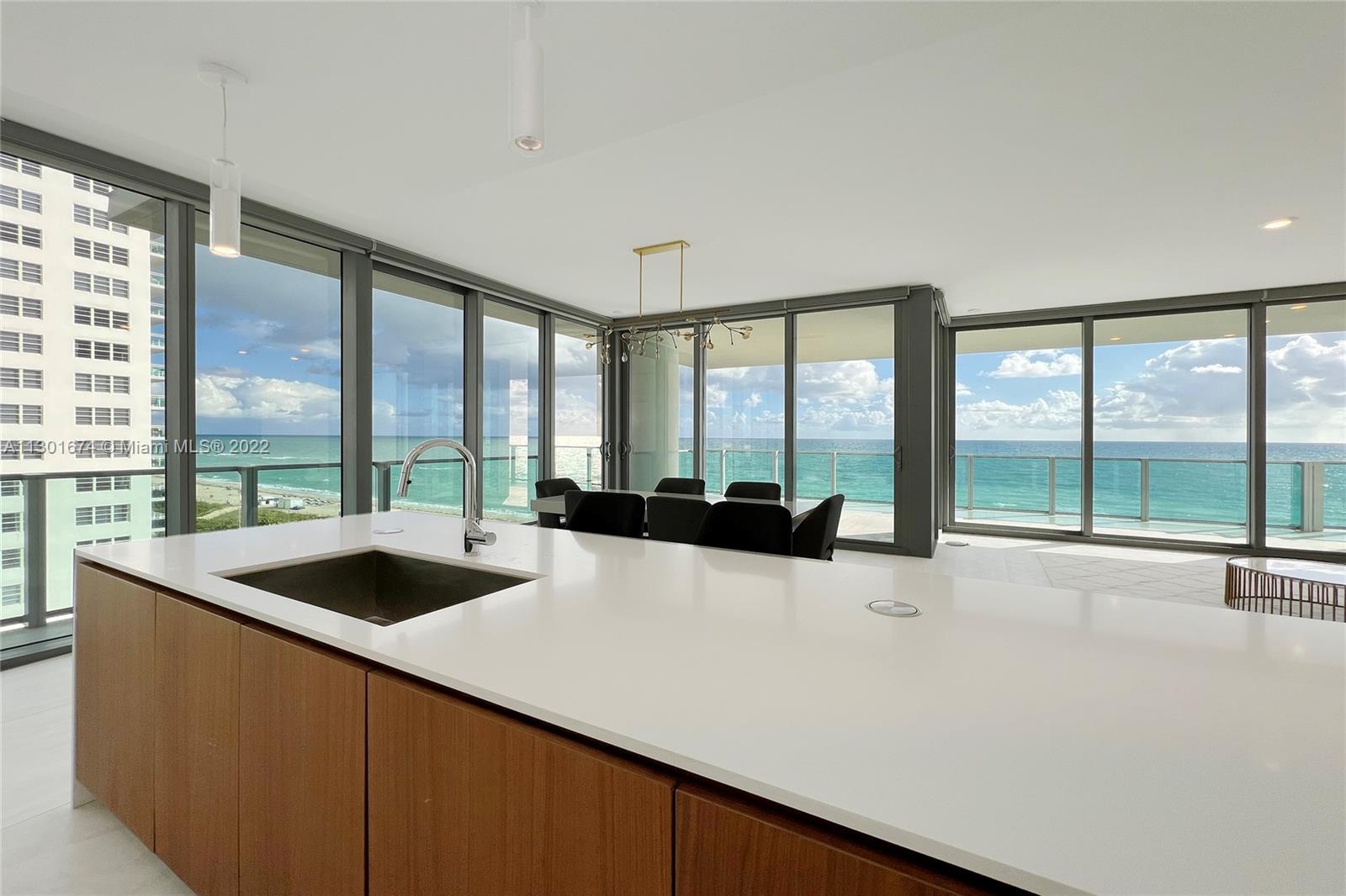 North Beach Miami Beach, FL 33141 - Photo 5 of 23 a large white kitchen with a large window