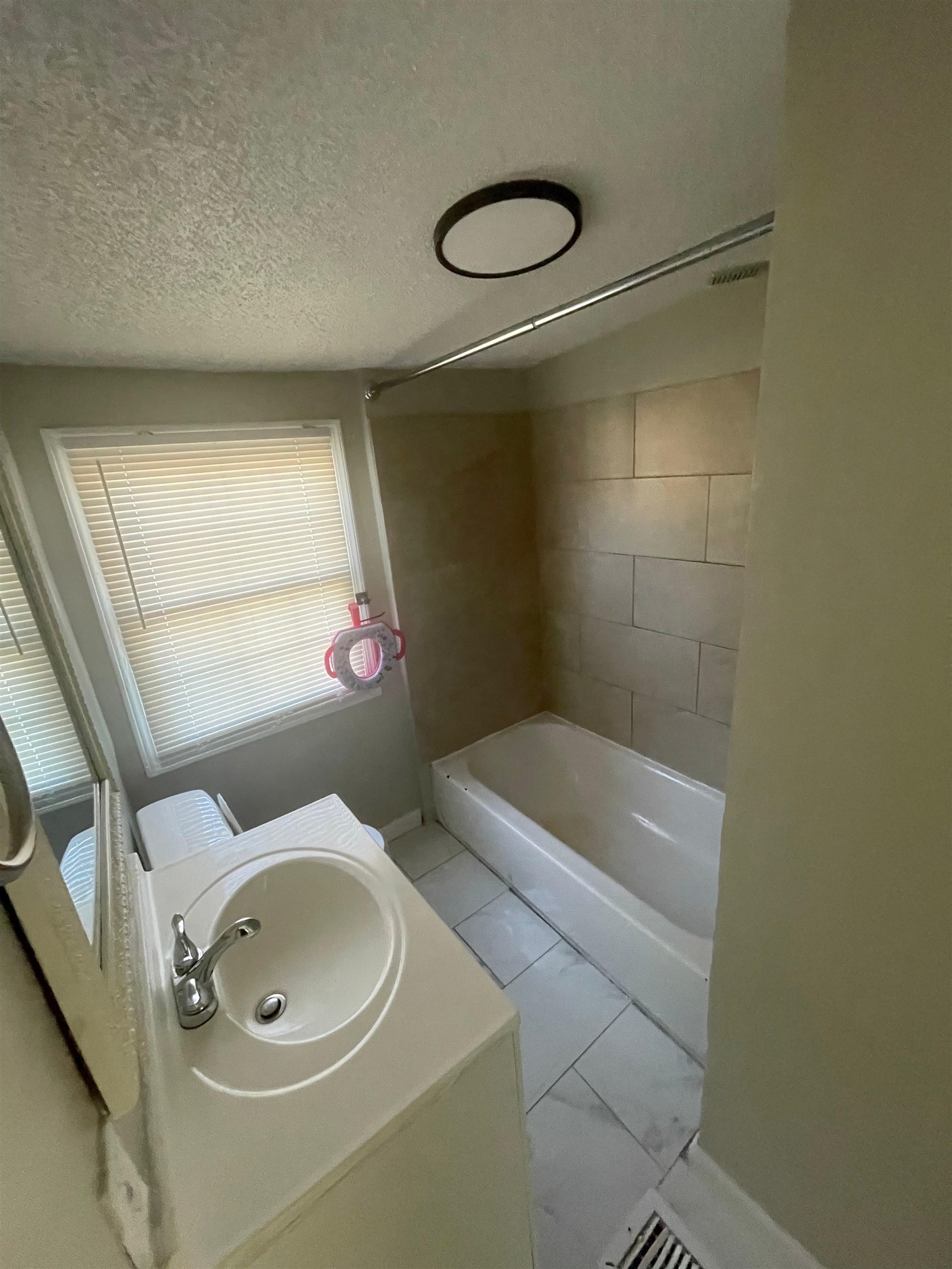 3466 Carrington Road Memphis, TN 38111 - Photo 9 of 14 a bathroom with a toilet sink and mirror