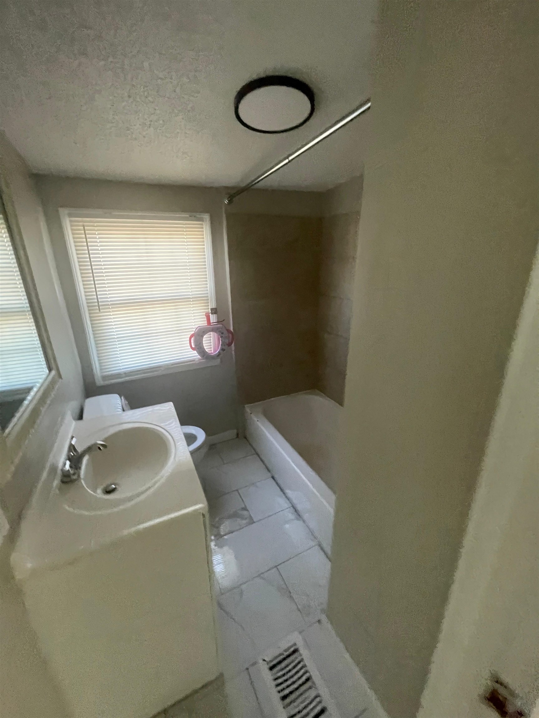 3466 Carrington Road Memphis, TN 38111 - Photo 10 of 14 a bathroom with a sink toilet and shower