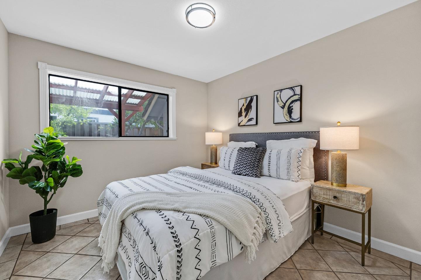 463 Becado Place Fremont, CA 94539 - Photo 19 of 74 a bedroom with a bed and a potted plant
