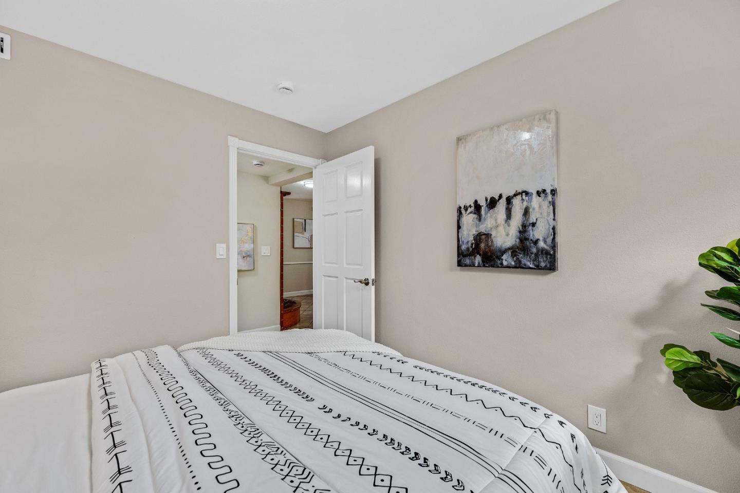 463 Becado Place Fremont, CA 94539 - Photo 20 of 74 a bedroom with a bed and a potted plant
