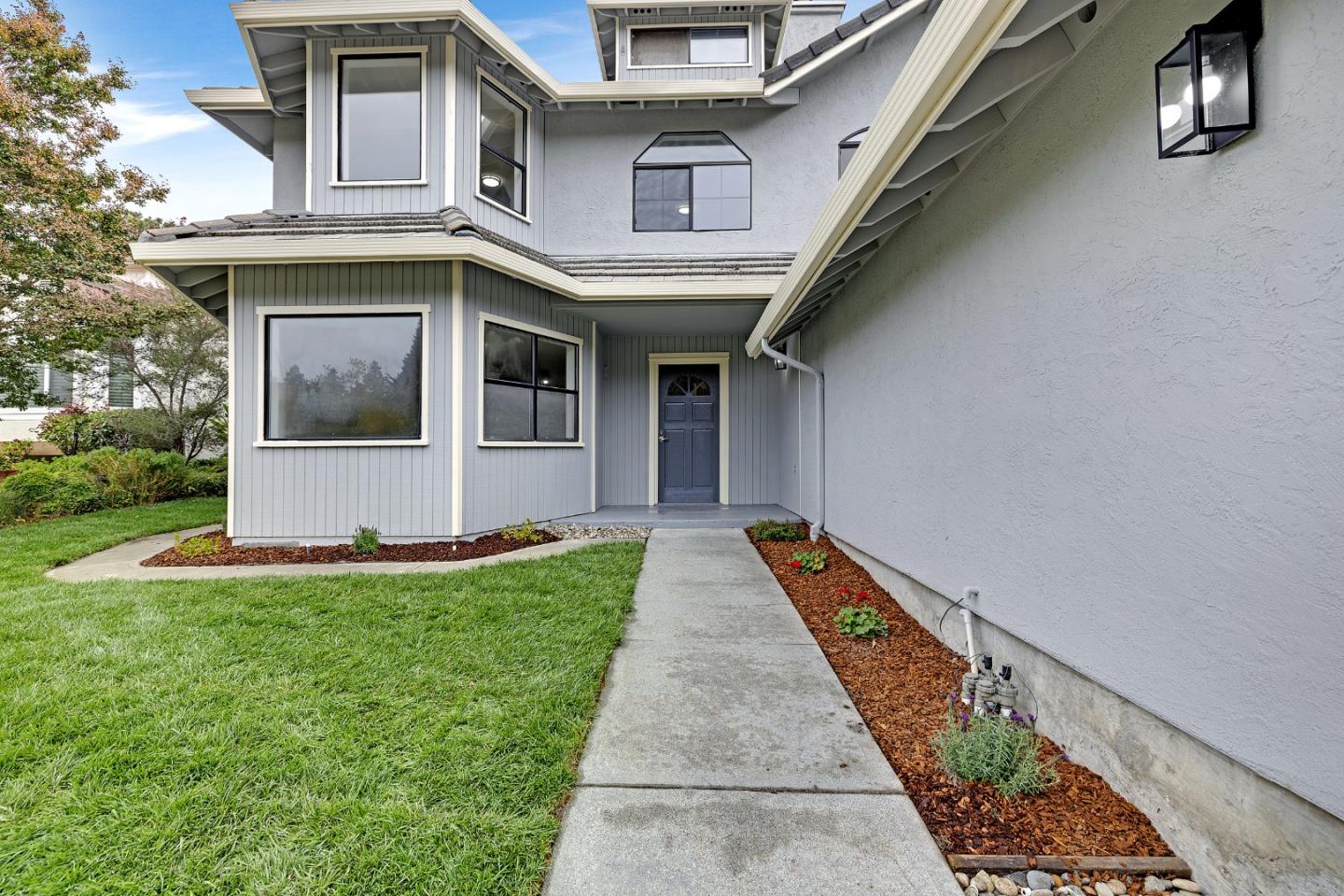 463 Becado Place Fremont, CA 94539 - Photo 2 of 74 a front view of a house with a yard