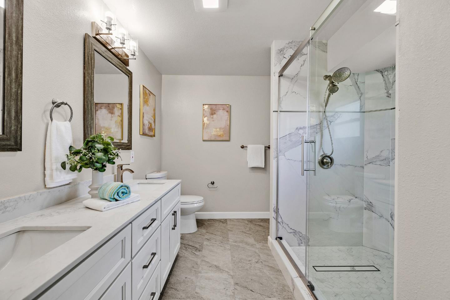 463 Becado Place Fremont, CA 94539 - Photo 27 of 74 a bathroom with a double vanity sink toilet and shower