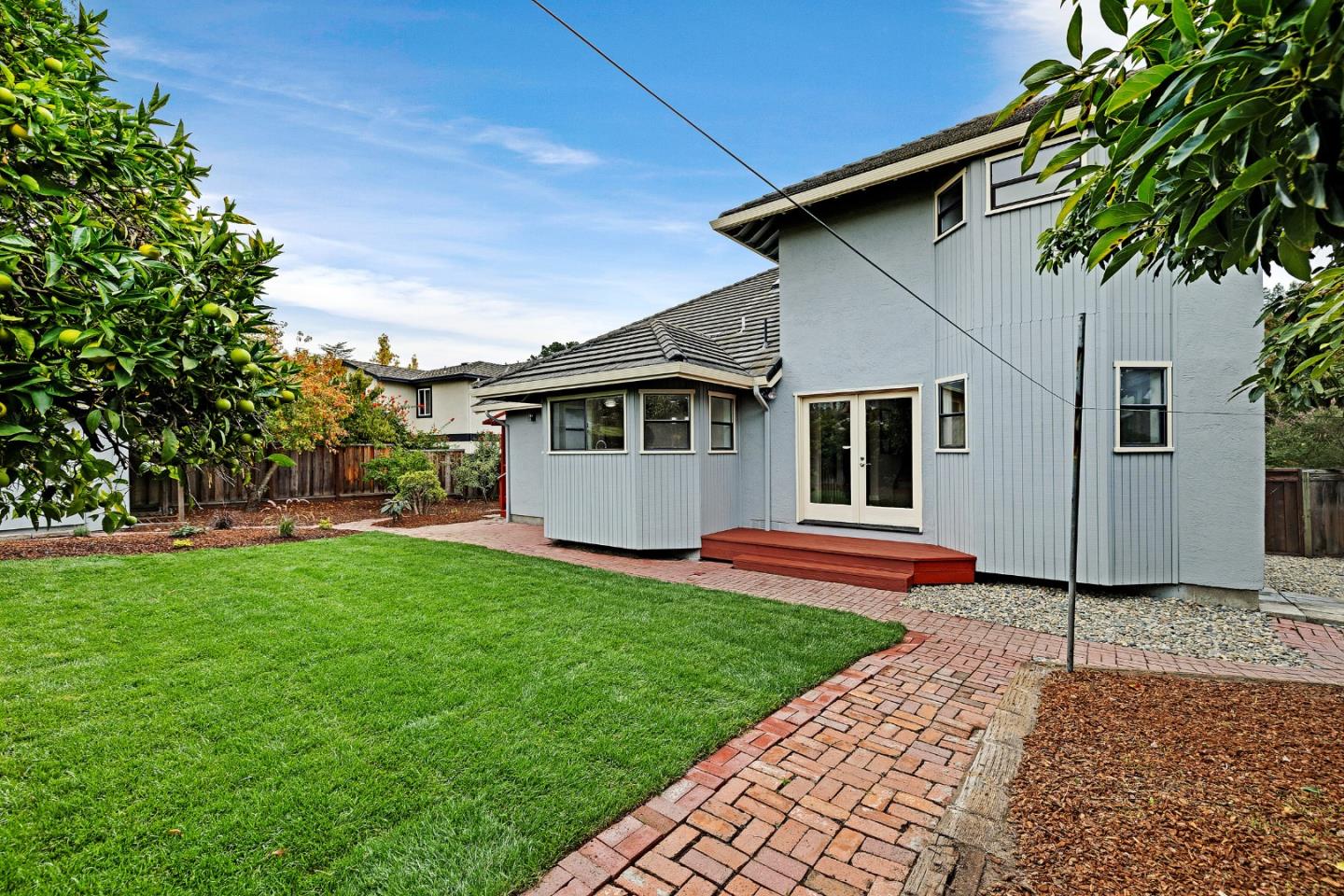 463 Becado Place Fremont, CA 94539 - Photo 42 of 74 a front view of a house with a garden and yard