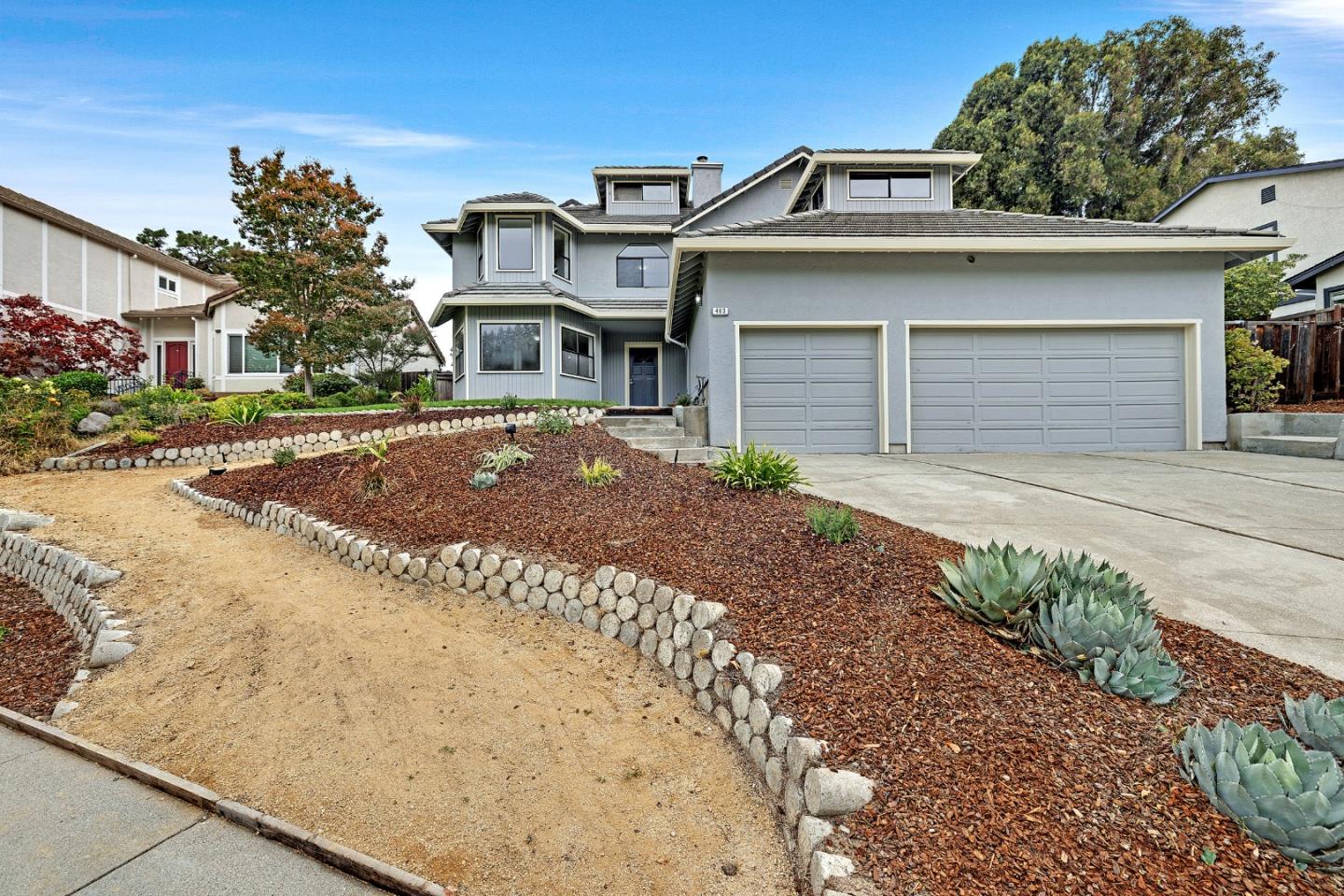 463 Becado Place Fremont, CA 94539 - Photo 54 of 74 a front view of a house with a yard and garage