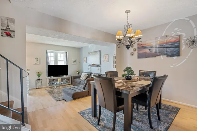 a kitchen with granite countertop a stove a sink and a refrigerator