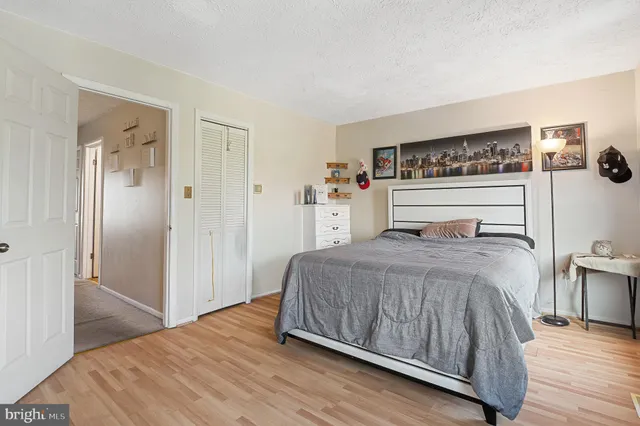 a view of a bedroom with cabinets and flat screen tv