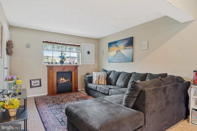 a living room with furniture and windows