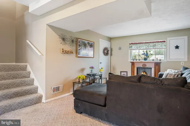 a living room with furniture and a rug