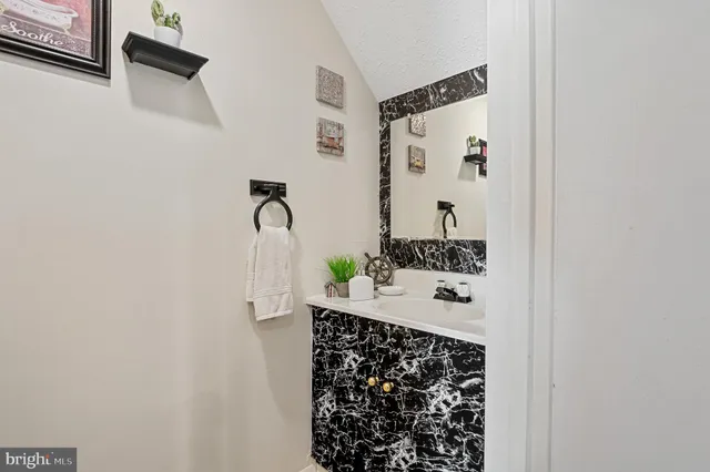 a bathroom with a shower and a mirror