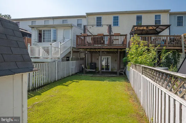 a view of a chairs and table in patio