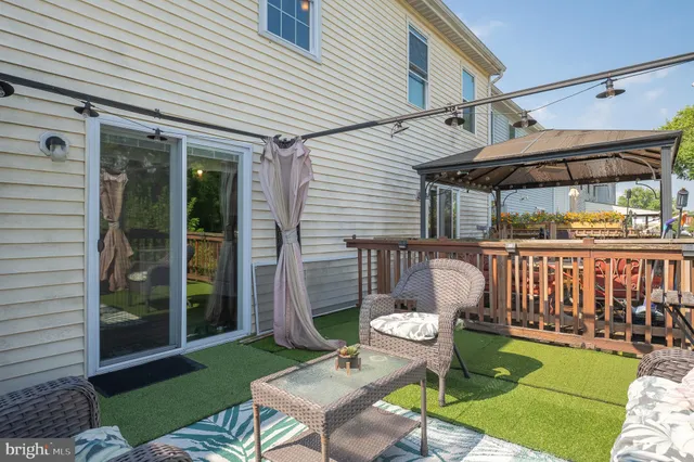 a balcony with furniture and a garden