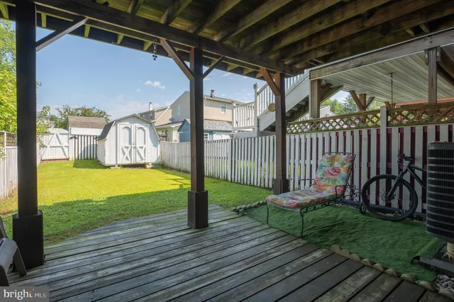 a view of a house with wooden fence