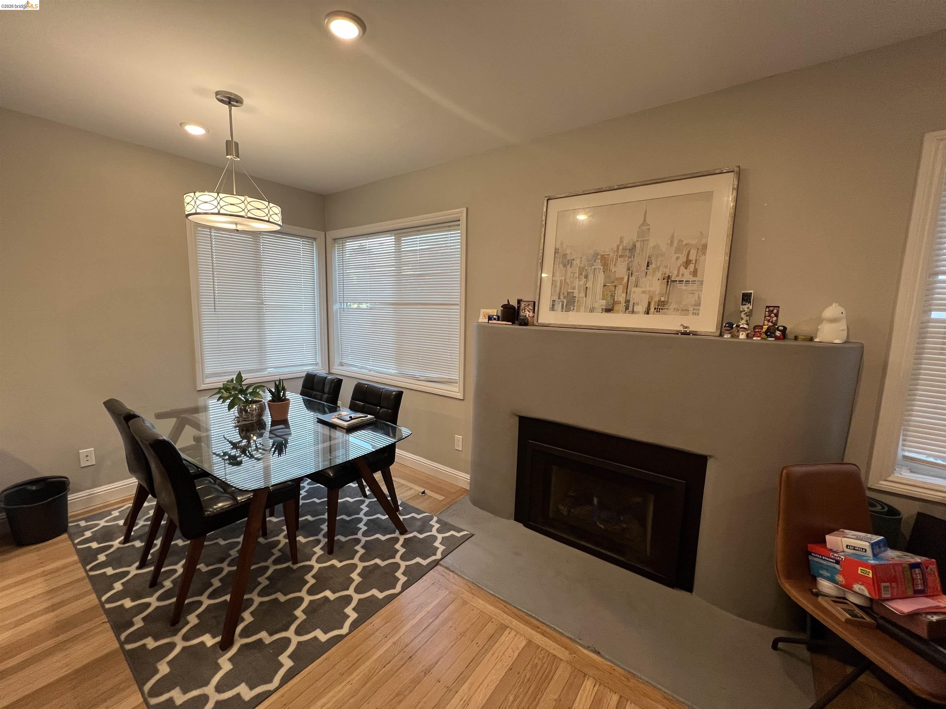 2548 Virginia Street Berkeley, CA 94709 - Photo 2 of 9 a living room with furniture and a fireplace