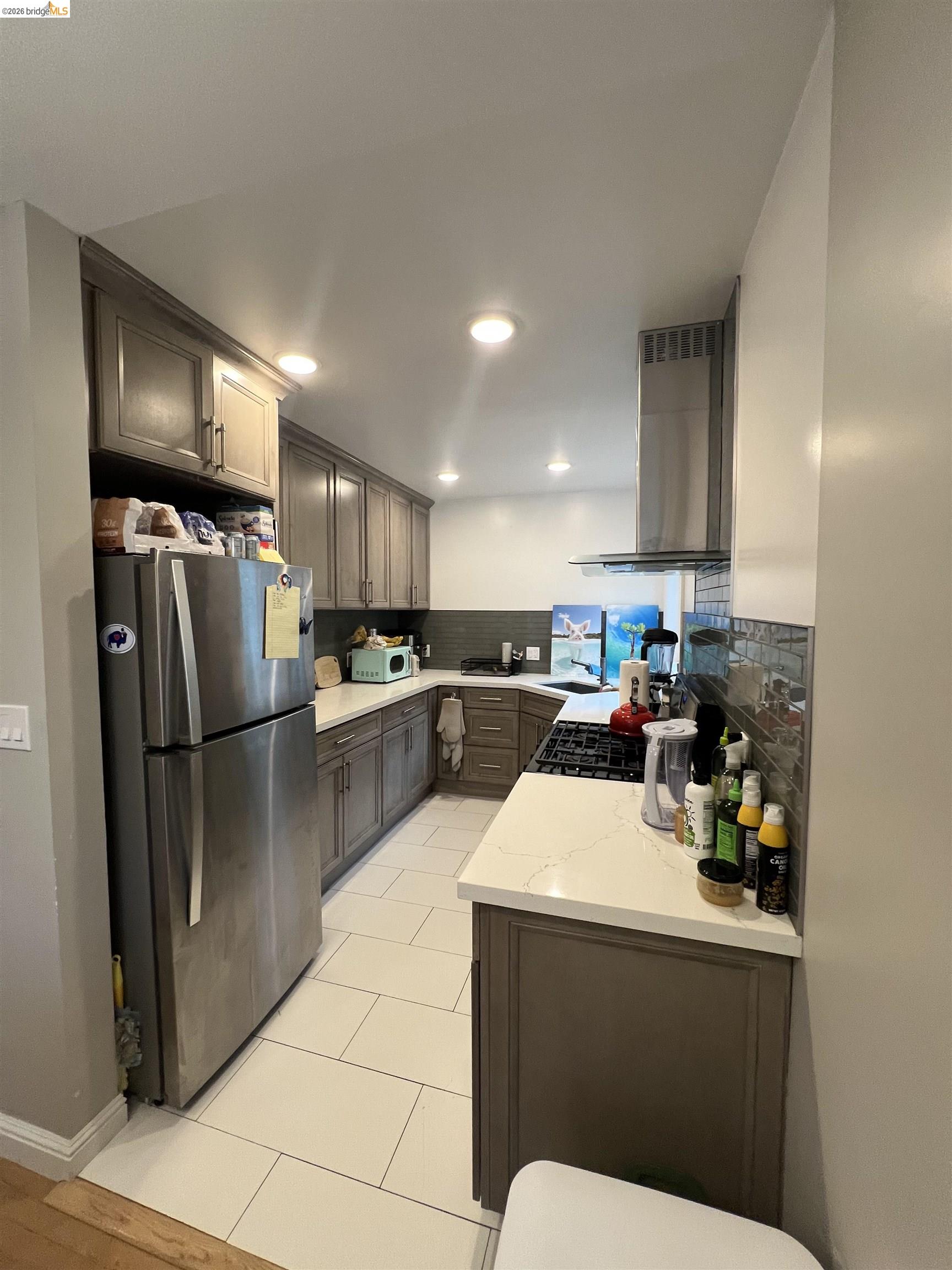 2548 Virginia Street Berkeley, CA 94709 - Photo 4 of 9 a kitchen with a sink stainless steel appliances and cabinets
