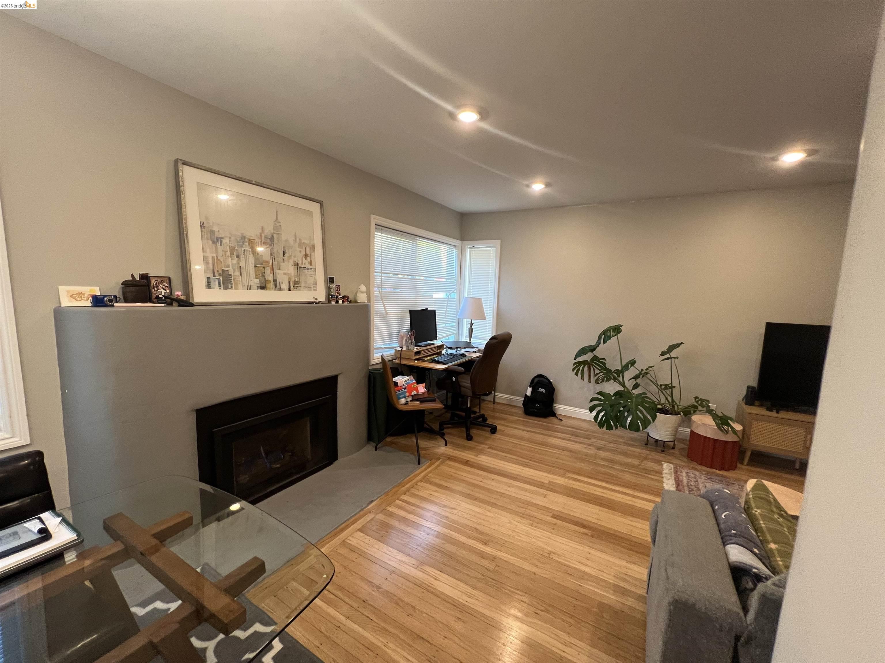 2548 Virginia Street Berkeley, CA 94709 - Photo 7 of 9 a bed room with furniture and a fireplace