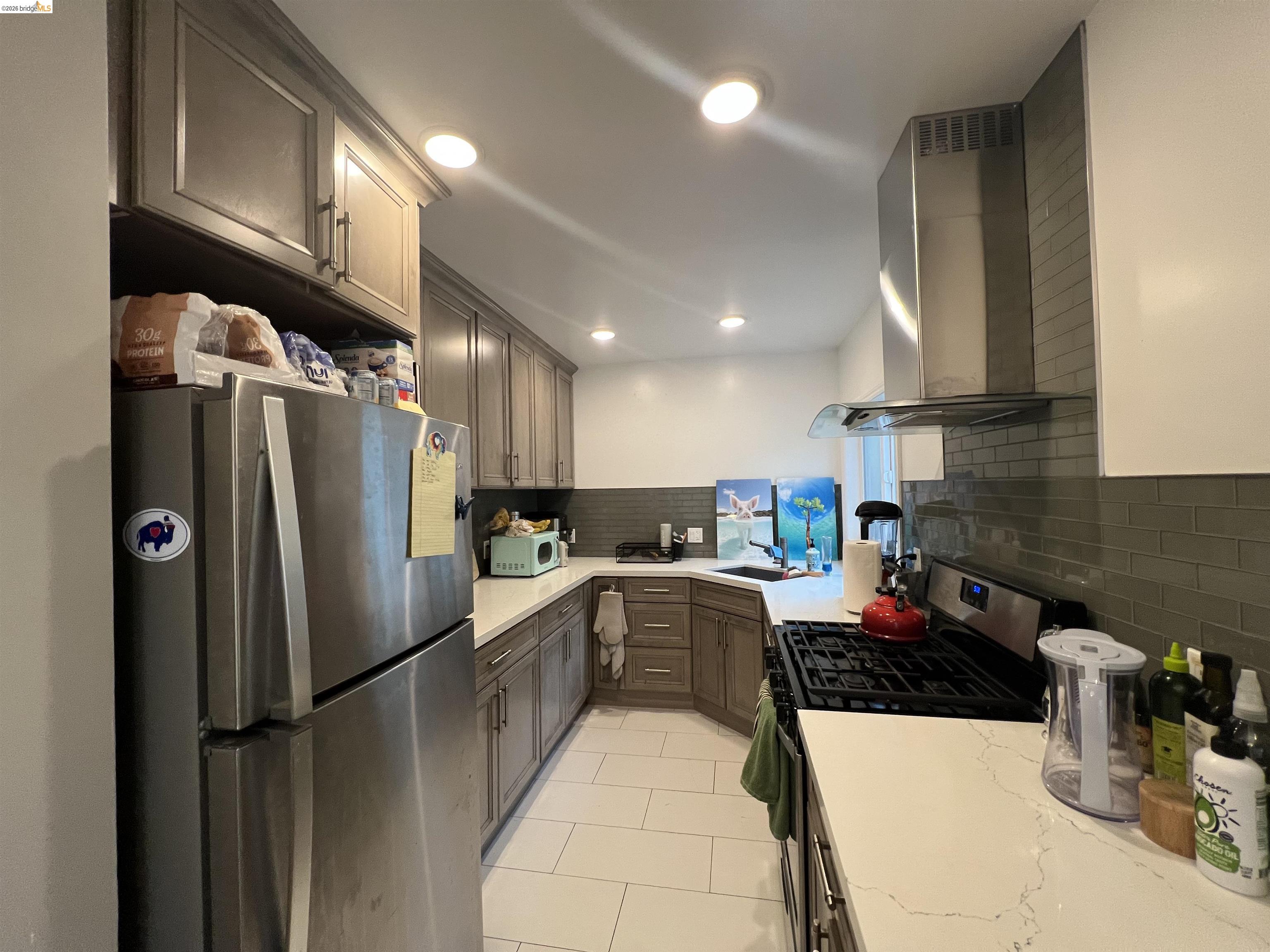 2548 Virginia Street Berkeley, CA 94709 - Photo 8 of 9 a kitchen with refrigerator and cabinets