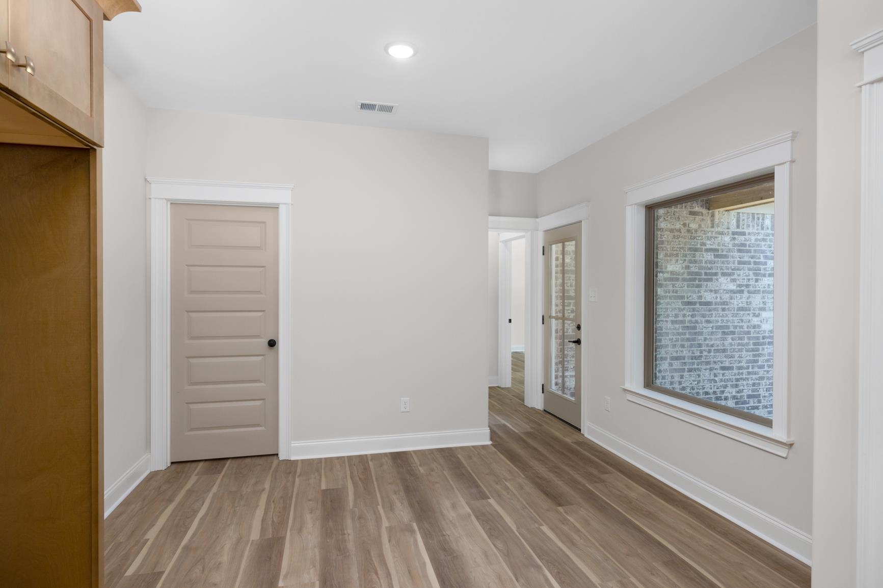 319 North Maple Street Covington, TN 38019 - Photo 14 of 32 an empty room with closet and windows
