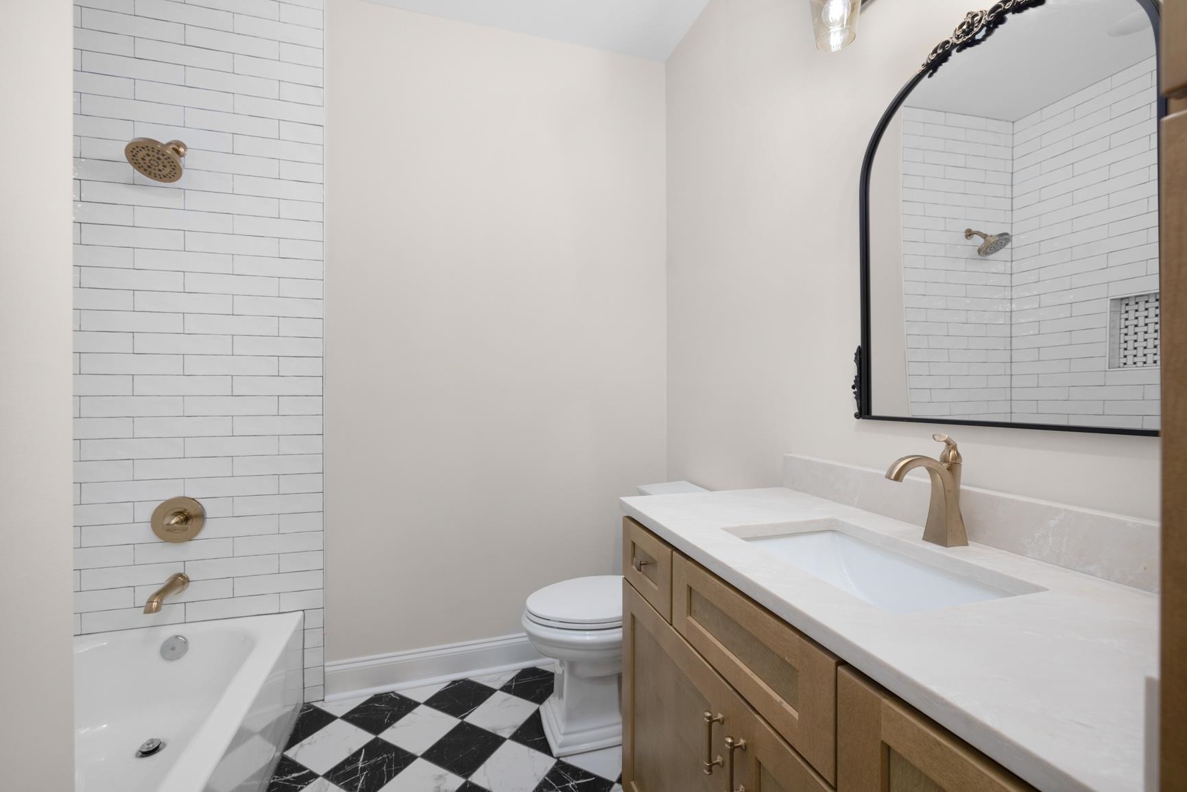 319 North Maple Street Covington, TN 38019 - Photo 23 of 32 a bathroom with a sink a toilet and shower