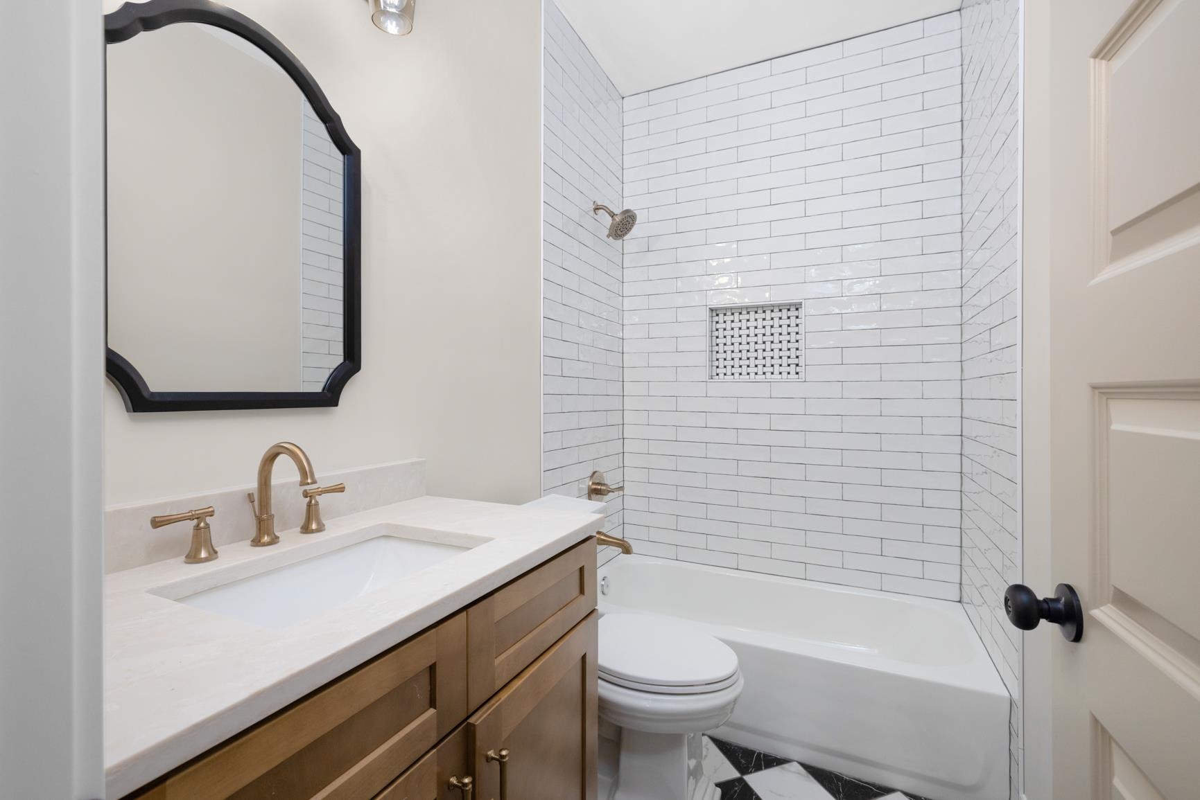 319 North Maple Street Covington, TN 38019 - Photo 28 of 32 a bathroom with a sink a toilet and shower