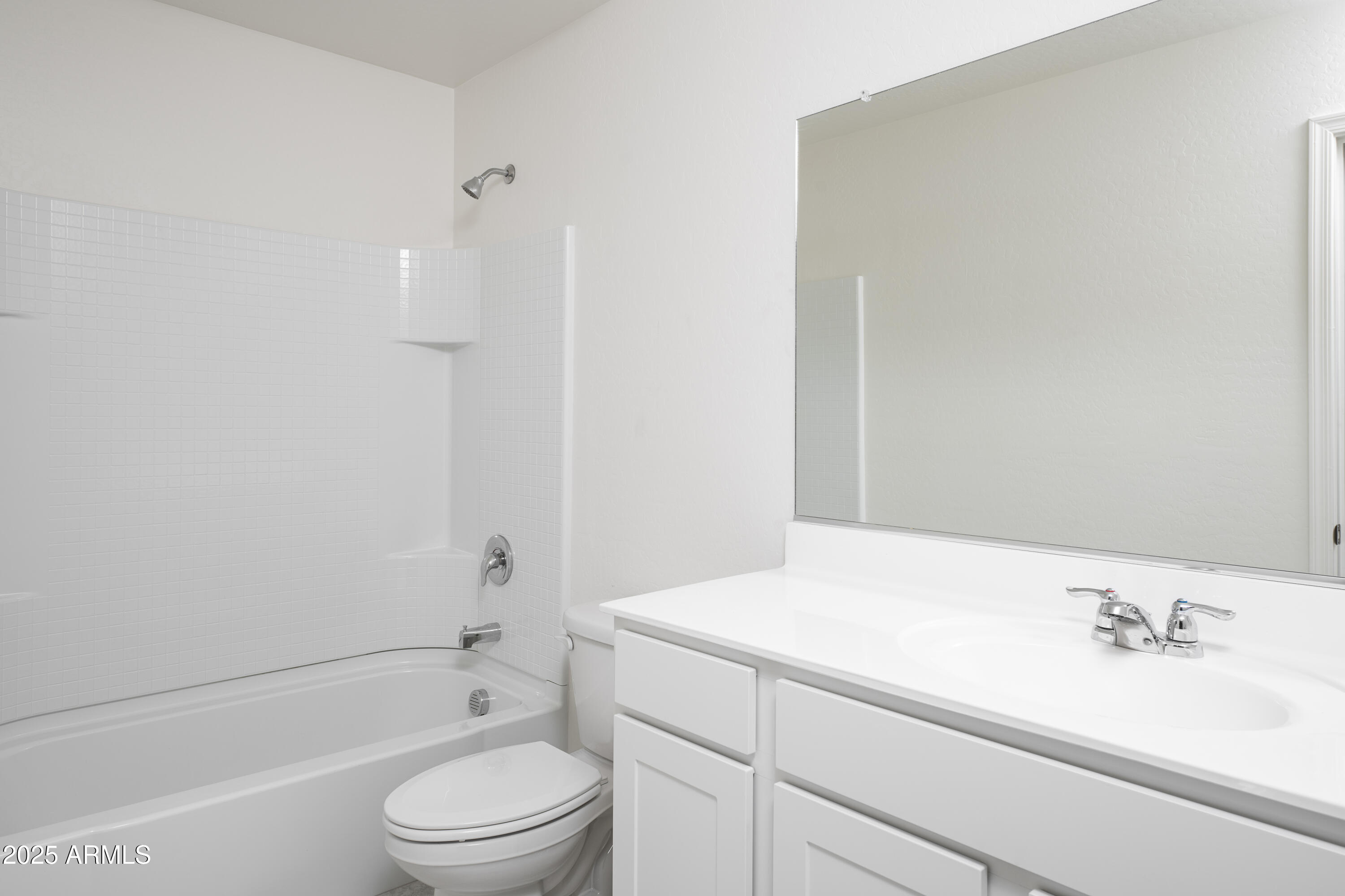 10016 South 58th Lane Laveen, AZ 85339 - Photo 14 of 17 a bathroom with a sink a toilet and a bathtub