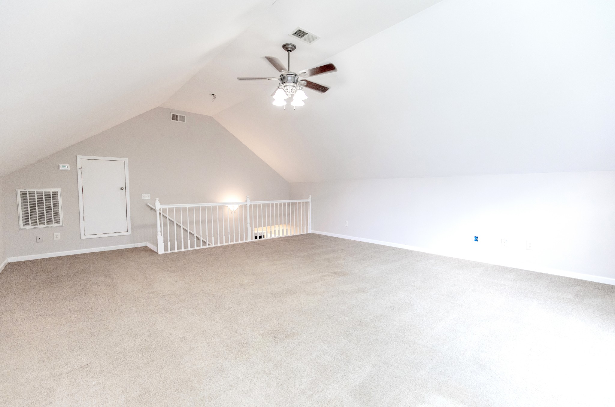443 Clearview Road Cottontown, TN 37048 - Photo 14 of 21 an empty room with chandelier fan and windows