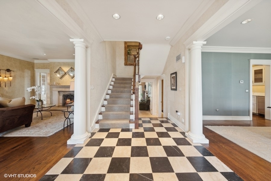 710 South County Line Road Hinsdale, IL 60521 - Photo 12 of 63 a view of a big room with wooden floor and a black white checkered floor
