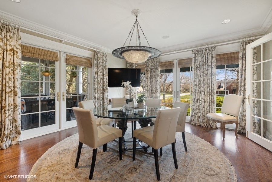 710 South County Line Road Hinsdale, IL 60521 - Photo 17 of 63 a view of a dining room with furniture window and wooden floor
