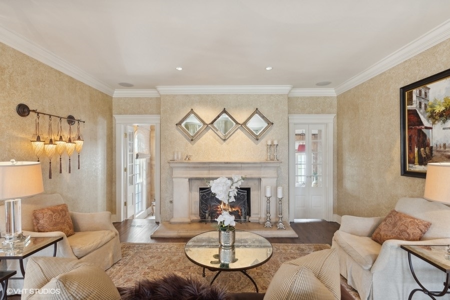 710 South County Line Road Hinsdale, IL 60521 - Photo 18 of 63 a living room with furniture a fireplace and a table