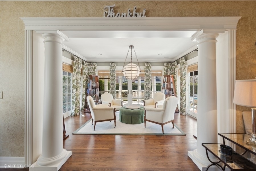 710 South County Line Road Hinsdale, IL 60521 - Photo 21 of 63 a dining room with wooden floor a chandelier