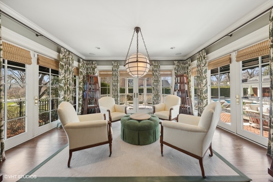 710 South County Line Road Hinsdale, IL 60521 - Photo 22 of 63 a living room with patio furniture and a chandelier
