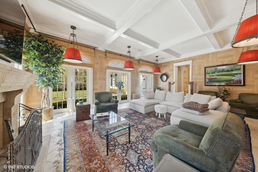 710 South County Line Road Hinsdale, IL 60521 - Photo 24 of 63 a living room with furniture large window and flat screen tv
