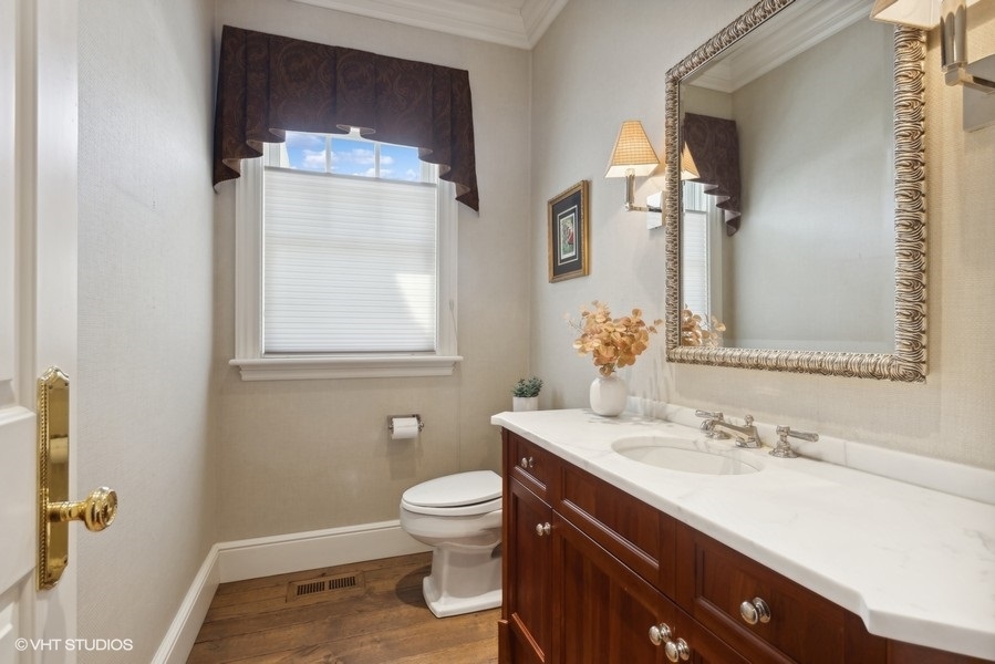 710 South County Line Road Hinsdale, IL 60521 - Photo 26 of 63 a bathroom with a sink vanity and toilet