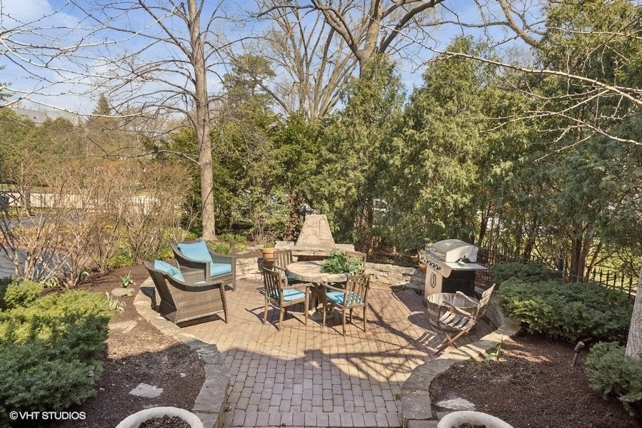 710 South County Line Road Hinsdale, IL 60521 - Photo 29 of 63 a view of a patio with chairs and tables