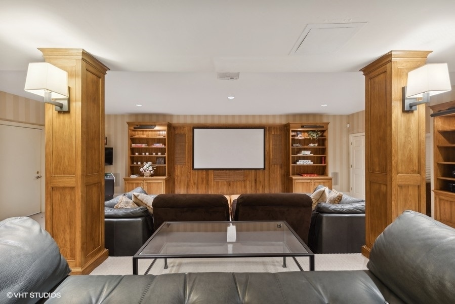 710 South County Line Road Hinsdale, IL 60521 - Photo 47 of 63 a living room with furniture a lamp and a large window