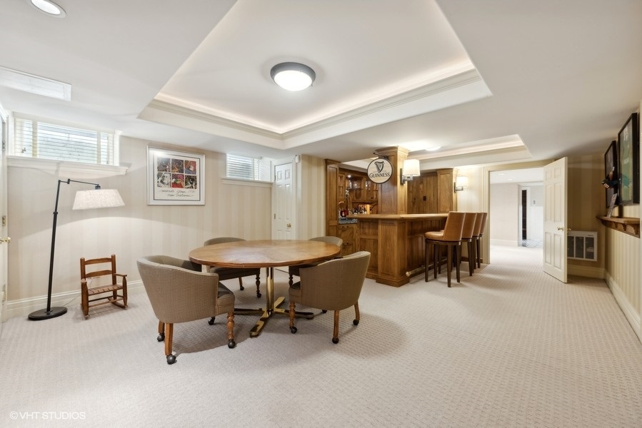 710 South County Line Road Hinsdale, IL 60521 - Photo 48 of 63 a view of a livingroom with furniture and a kitchen