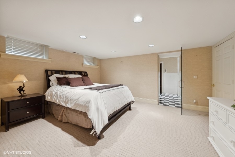 710 South County Line Road Hinsdale, IL 60521 - Photo 50 of 63 a spacious bedroom with a bed and a cabinets