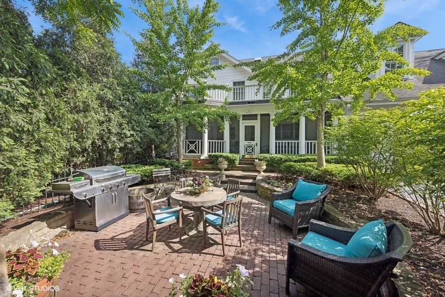710 South County Line Road Hinsdale, IL 60521 - Photo 57 of 63 a view of a patio with couches table and chairs and potted plants