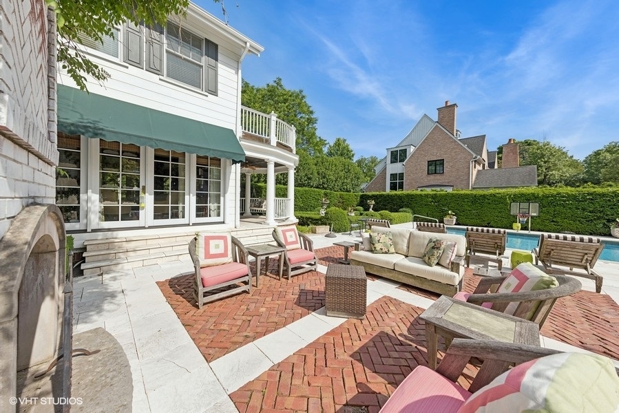 710 South County Line Road Hinsdale, IL 60521 - Photo 58 of 63 a view of a patio with couches chairs and wooden floor