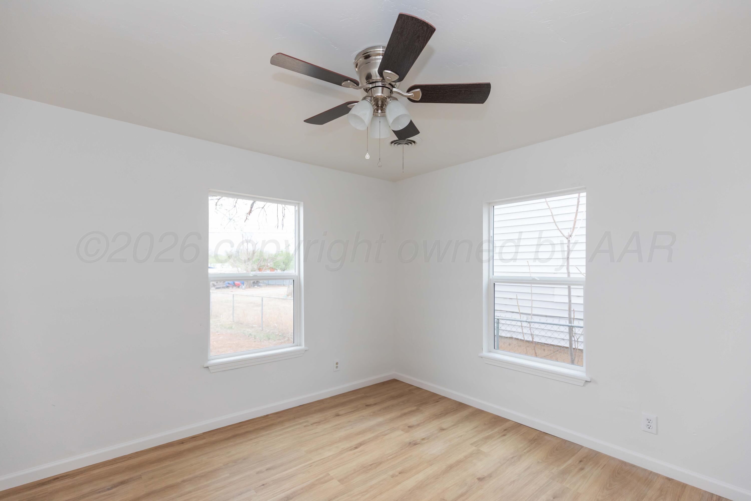 205 South Forest Street Amarillo, TX 79106 - Photo 16 of 29 a view of an empty room with wooden floor and a window