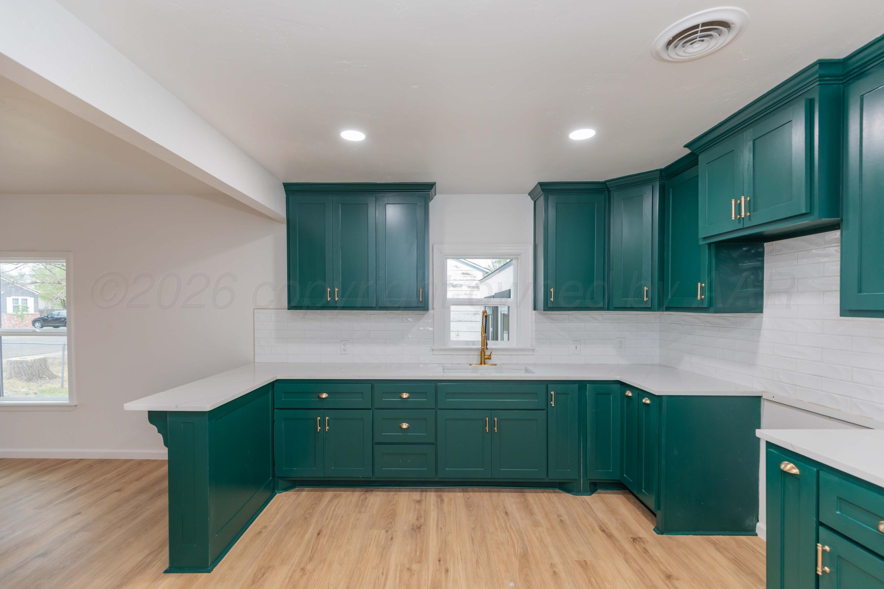 205 South Forest Street Amarillo, TX 79106 - Photo 2 of 29 a room with lots of wooden cabinets and outdoor seating