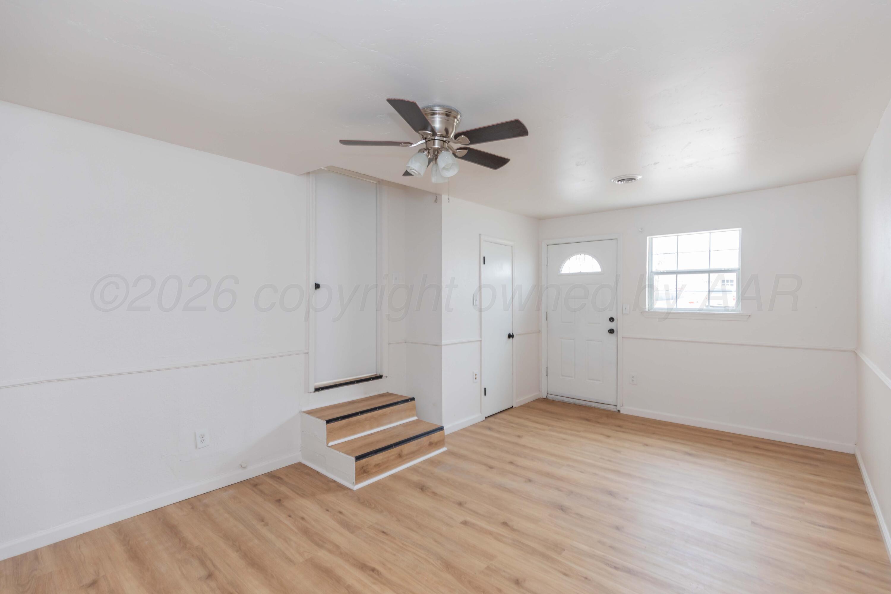 205 South Forest Street Amarillo, TX 79106 - Photo 23 of 29 wooden floor in an empty room with a window