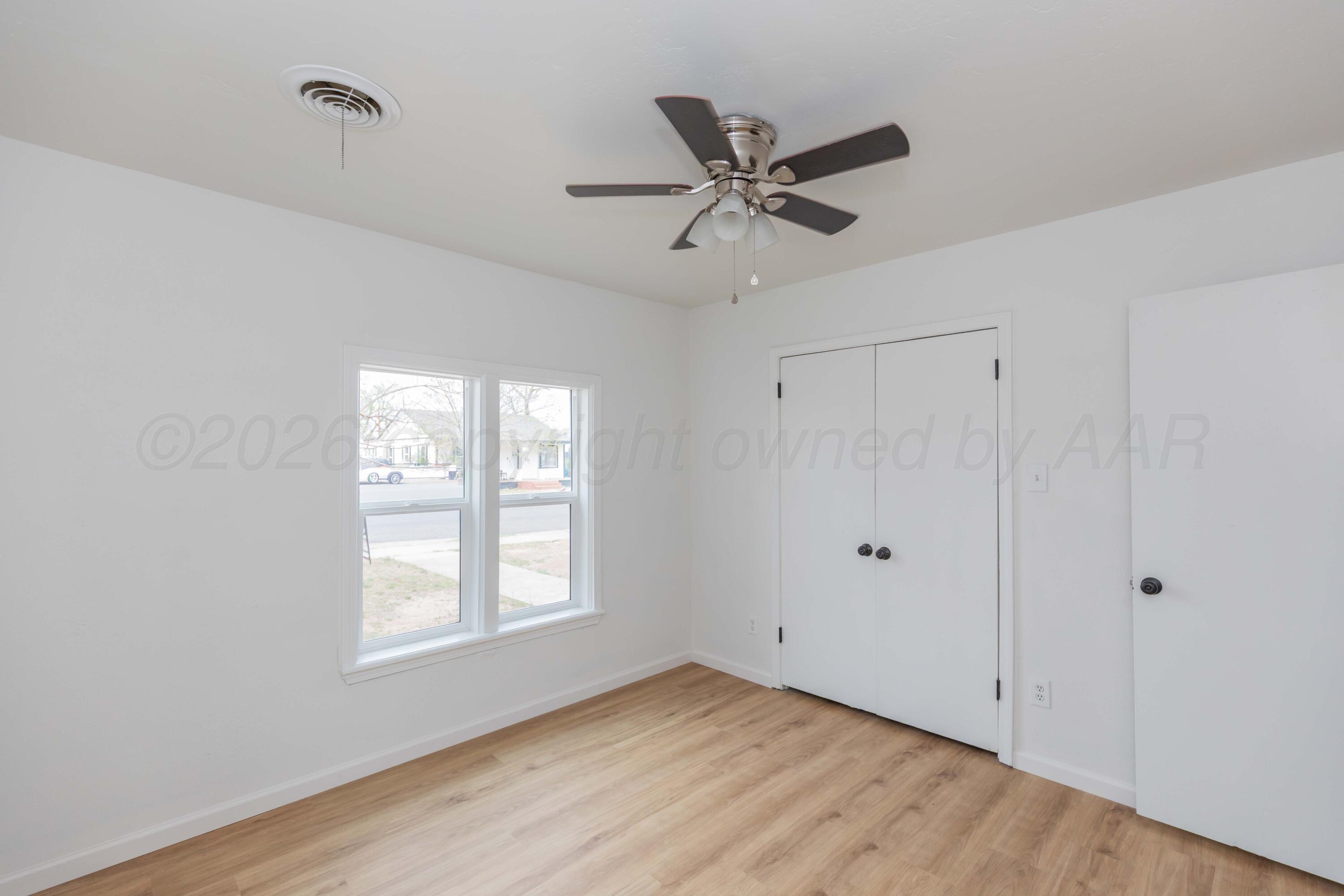 205 South Forest Street Amarillo, TX 79106 - Photo 25 of 29 a view of a room with wooden floor and windows
